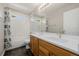Bathroom featuring a large vanity with double sinks, tile floor, and a shower/tub combo at 3126 Aspen Creek Dr, Highlands Ranch, CO 80129