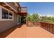 Multi-level deck showcasing the home's exterior, with wood railings and steps at 3126 Aspen Creek Dr, Highlands Ranch, CO 80129
