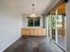 Open dining area featuring slate floors, built-in cabinets, and sliding glass doors to the deck at 3126 Aspen Creek Dr, Highlands Ranch, CO 80129