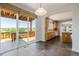 Open dining area with sliding glass doors to deck and views, connected to kitchen through archway at 3126 Aspen Creek Dr, Highlands Ranch, CO 80129