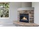 Close up of a charming stone fireplace, adding warmth and character to the home at 3126 Aspen Creek Dr, Highlands Ranch, CO 80129
