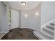 Bright and airy foyer featuring tile flooring, a staircase, and a front door with sidelight windows at 3126 Aspen Creek Dr, Highlands Ranch, CO 80129