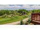 Beautiful view of a golf course from an elevated deck at 3126 Aspen Creek Dr, Highlands Ranch, CO 80129