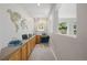 Office with built-in desk and storage cabinets, decorative world map, and bright natural light at 3126 Aspen Creek Dr, Highlands Ranch, CO 80129