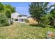Grassy backyard with a storage shed and partial fencing, perfect for outdoor activities and privacy at 12678 W Dorado Pl, Littleton, CO 80127