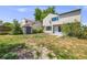 Spacious backyard featuring lush greenery, storage shed, and a rock-lined garden bed at 12678 W Dorado Pl, Littleton, CO 80127
