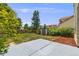 Large backyard with mature trees, lush lawn, a concrete patio and a convenient storage shed at 12678 W Dorado Pl, Littleton, CO 80127