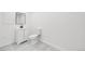 Modern bathroom featuring a sleek vanity, updated toilet, and stylish marble-look flooring at 12678 W Dorado Pl, Littleton, CO 80127