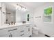 Bright bathroom featuring double sinks and natural light at 12678 W Dorado Pl, Littleton, CO 80127