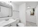 Clean bathroom featuring a single sink vanity and a separate shower room with modern finishes at 12678 W Dorado Pl, Littleton, CO 80127