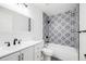 Nicely updated bathroom with tub and modern finishes at 12678 W Dorado Pl, Littleton, CO 80127