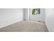 Cozy bedroom with neutral carpet and a window providing natural light at 12678 W Dorado Pl, Littleton, CO 80127