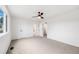 Spacious carpeted bedroom with ceiling fan and multiple doors at 12678 W Dorado Pl, Littleton, CO 80127