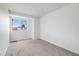 Bright bedroom with neutral carpet and a window providing natural light at 12678 W Dorado Pl, Littleton, CO 80127