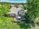 Backyard featuring a patio with a hot tub and outdoor seating, perfect for relaxation at 11904 W Auburn Dr, Denver, CO 80228