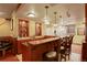 Finished basement with bar and stools for entertaining at 11904 W Auburn Dr, Denver, CO 80228