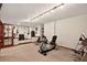 Multi-purpose basement featuring workout and music areas with professional equipment and ample space at 11904 W Auburn Dr, Denver, CO 80228