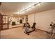 Large basement area featuring an exercise bike, free weights and music/entertainment area at 11904 W Auburn Dr, Denver, CO 80228