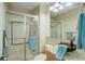 Contemporary bathroom with glass-enclosed shower and granite vanity with a dark vessel sink at 11904 W Auburn Dr, Denver, CO 80228