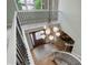 This grand two-story foyer features a decorative chandelier, staircase, and hardwood floors, creating an inviting entrance at 11904 W Auburn Dr, Denver, CO 80228