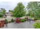 Attractive home exterior with a well-maintained front yard and patio furniture at 11904 W Auburn Dr, Denver, CO 80228