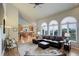 Open living area with vaulted ceilings, large windows, and seamless flow to the kitchen at 11904 W Auburn Dr, Denver, CO 80228