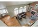 Aerial view of the living room with fireplace, comfortable seating, and abundant natural light at 11904 W Auburn Dr, Denver, CO 80228