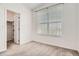 Bright bedroom with walk-in closet featuring a bright window and neutral carpet at 9185 Wilde Ln # 301, Parker, CO 80134