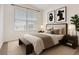 Comfortable bedroom with a window, modern decor, and a cozy ambiance at 9185 Wilde Ln # 301, Parker, CO 80134