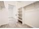Walk-in closet with shelving and rod space for storage, with an entrance to another room at 9185 Wilde Ln # 301, Parker, CO 80134
