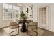 Cozy dining room with round table, stylish chairs, and bright natural light at 9185 Wilde Ln # 301, Parker, CO 80134