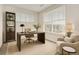 Well-lit home office with a modern desk, comfortable chair, and ample natural light at 9185 Wilde Ln # 301, Parker, CO 80134