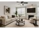 Bright living room featuring a fireplace, contemporary furniture, and a neutral color palette at 9185 Wilde Ln # 301, Parker, CO 80134