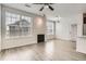 Bright, open living room with a fireplace, large windows, and modern fixtures at 9185 Wilde Ln # 301, Parker, CO 80134