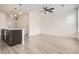 Spacious living area featuring a kitchen island and light-filled ambiance at 9185 Wilde Ln # 301, Parker, CO 80134
