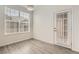 Well-lit room with a window, door, and neutral color palette, with modern flooring at 9185 Wilde Ln # 301, Parker, CO 80134