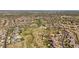 Overhead view of a neighborhood with walking trails, a lake, and multiple community pools at 10687 Featherwalk Way, Highlands Ranch, CO 80126