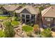 Beautiful backyard featuring a fire pit, landscaped design, and an elevated deck with stairs at 10687 Featherwalk Way, Highlands Ranch, CO 80126