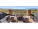Outdoor seating area with fire pit and mountain views at 10687 Featherwalk Way, Highlands Ranch, CO 80126