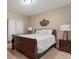 Cozy bedroom featuring warm neutral colors and a plush bed with bedside tables at 10687 Featherwalk Way, Highlands Ranch, CO 80126