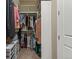 Walk-in closet with ample storage, shelving, and hanging space for organization at 10687 Featherwalk Way, Highlands Ranch, CO 80126