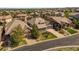Street view of a landscaped property with a three car garage at 10687 Featherwalk Way, Highlands Ranch, CO 80126
