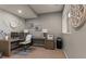 Functional home office with built-in desk, modern decor, and natural light at 10687 Featherwalk Way, Highlands Ranch, CO 80126