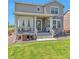 Spacious, lush backyard features a covered porch, perfect for relaxing and outdoor entertainment at 24325 E Ada Pl, Aurora, CO 80018