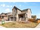 Charming home with a covered porch, three-car garage, and well-kept yard at 24325 E Ada Pl, Aurora, CO 80018