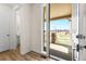Bright foyer with wood floors and a view of the front porch at 24325 E Ada Pl, Aurora, CO 80018