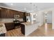 Stylish kitchen with granite countertops, stainless steel appliances, and wood floors at 24325 E Ada Pl, Aurora, CO 80018