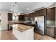 Spacious kitchen with stainless steel appliances, granite countertops, and large island at 24325 E Ada Pl, Aurora, CO 80018