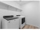 The well-equipped laundry room features modern appliances and ample storage space at 24325 E Ada Pl, Aurora, CO 80018