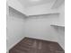 Spacious walk-in closet with multiple shelves and rods for optimal storage at 24325 E Ada Pl, Aurora, CO 80018